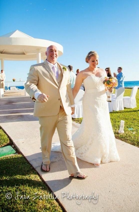 Groom and bride married walking down the aisle